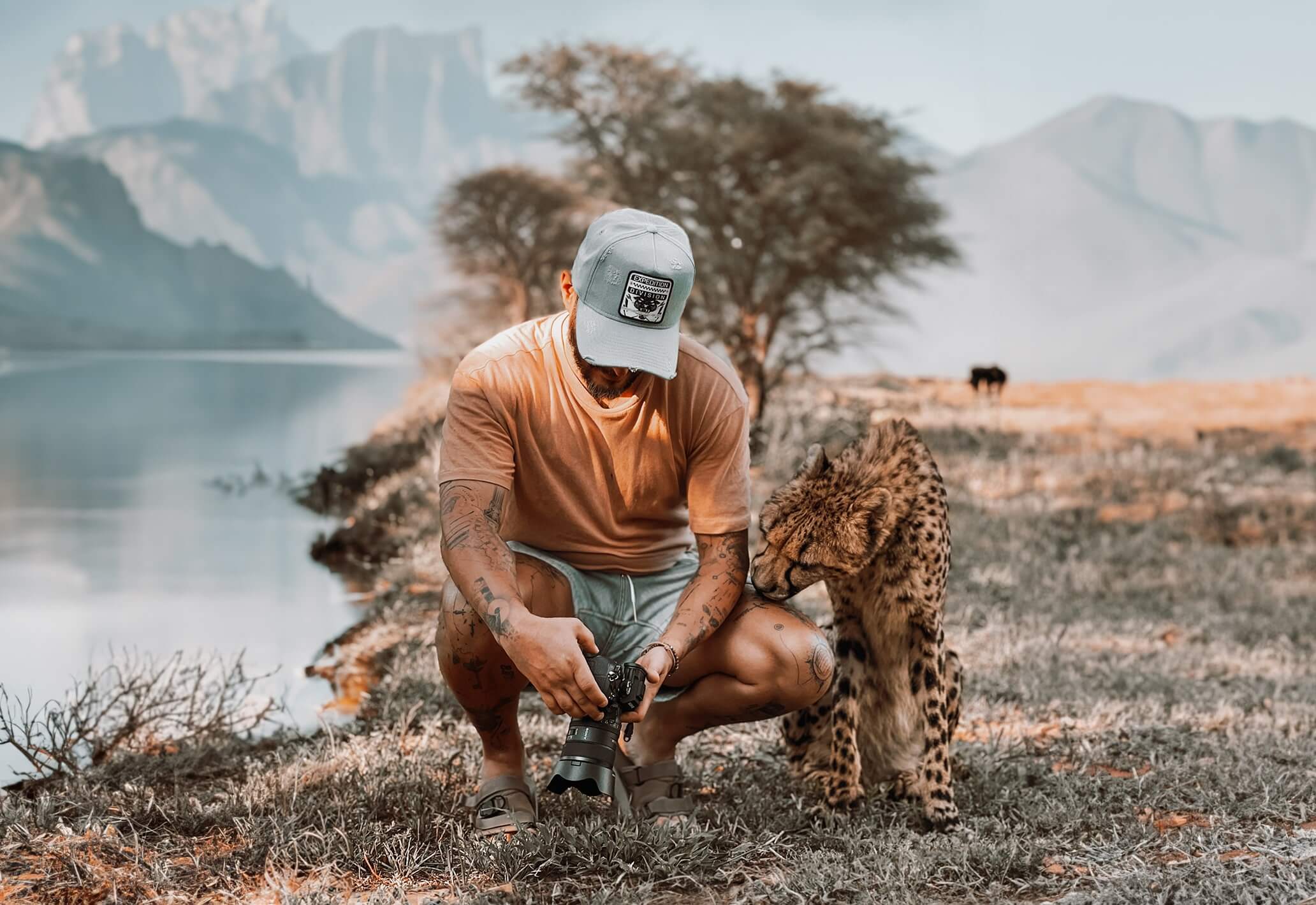 Kash Hasworth with a cheetah during African expedition